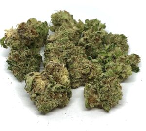 gorgeous greens golds and dark red pistils of grapefruit kush buds on white background