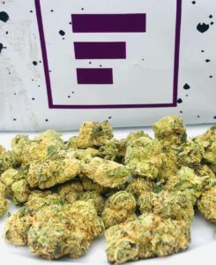 group of mule fuel buds in front of FADE cannabis logo